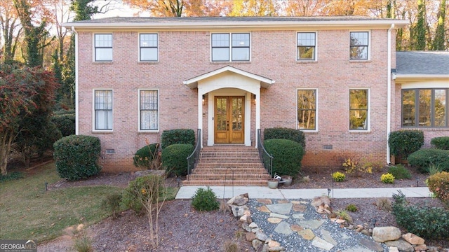 colonial home with french doors