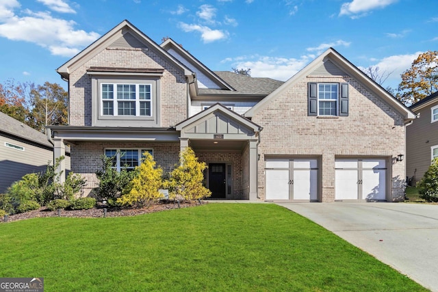 view of front of house featuring a garage and a front lawn