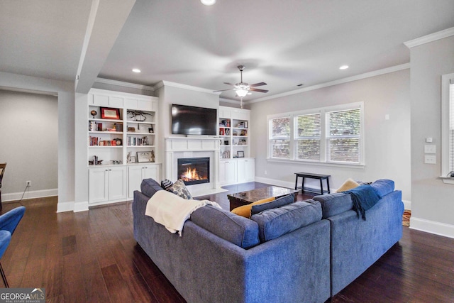 living room featuring dark hardwood / wood-style floors, ceiling fan, and ornamental molding