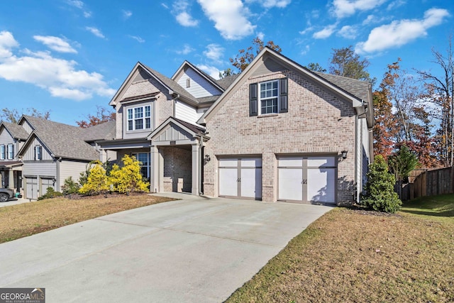 front facade featuring a front lawn and a garage