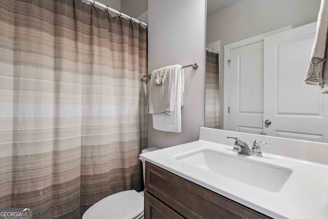 bathroom with vanity and toilet