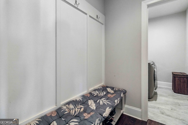 mudroom featuring wood-type flooring and washer / clothes dryer