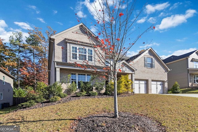 front of property with a garage and a front yard