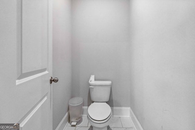 bathroom featuring tile patterned flooring and toilet