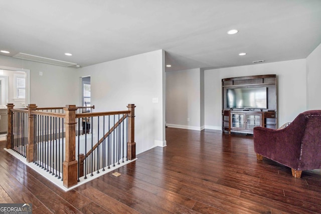 hall with dark hardwood / wood-style flooring