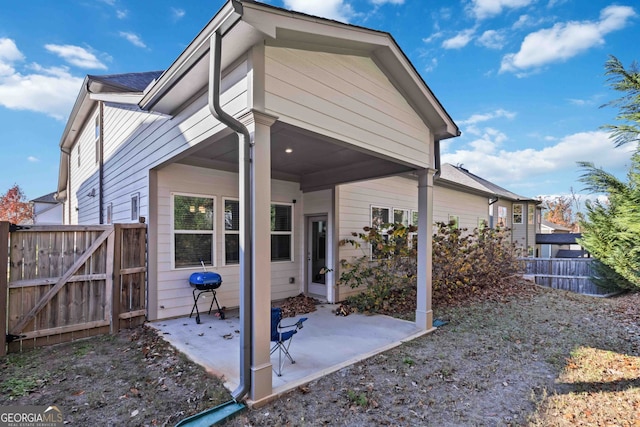 back of property featuring a patio