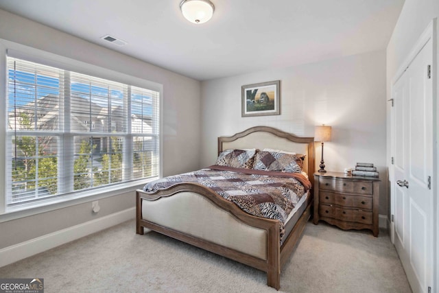 carpeted bedroom featuring a closet