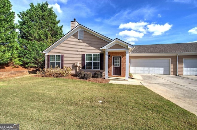 view of front of property featuring a garage and a front lawn