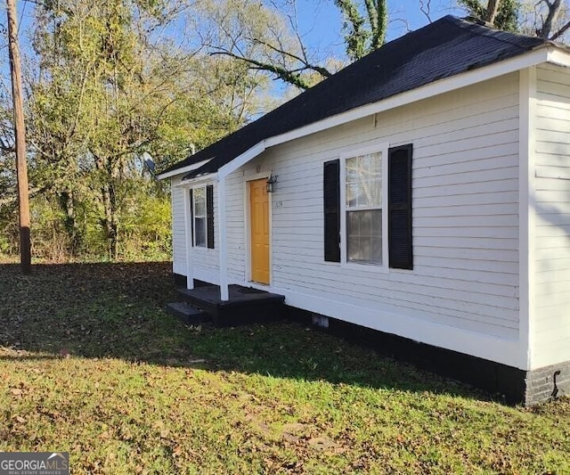 view of home's exterior featuring a lawn