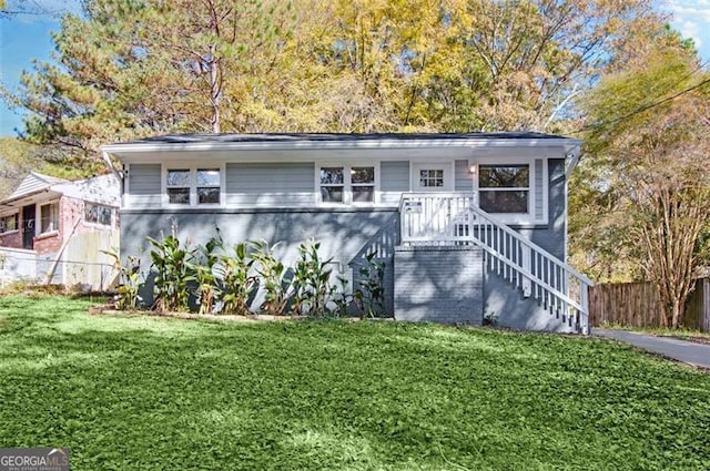 view of front of property with a front lawn