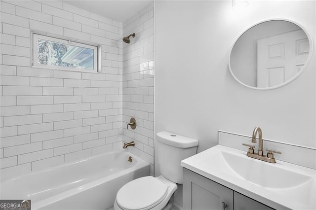 full bathroom featuring vanity, tiled shower / bath combo, and toilet