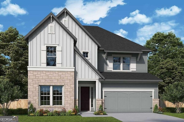 view of front of property with a garage and a front yard