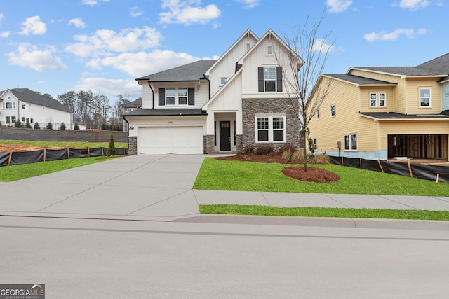 view of front of home with a garage and a front lawn