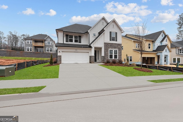 view of front of home with a garage and a front lawn