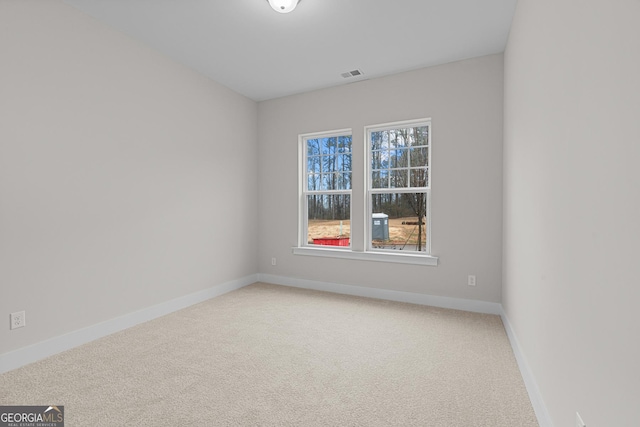 spare room featuring carpet floors