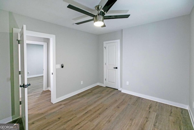 unfurnished bedroom with light hardwood / wood-style floors and ceiling fan