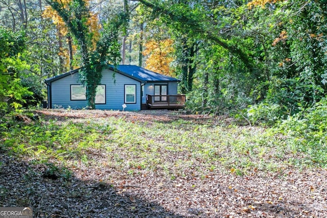 exterior space featuring a wooden deck