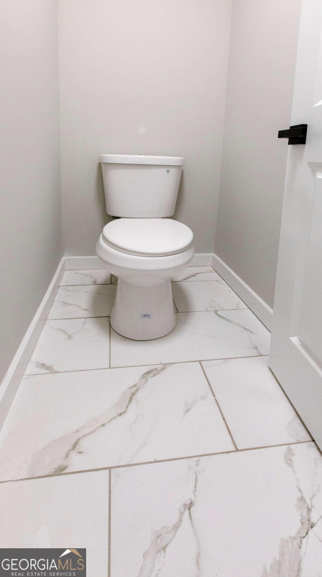 bathroom featuring toilet