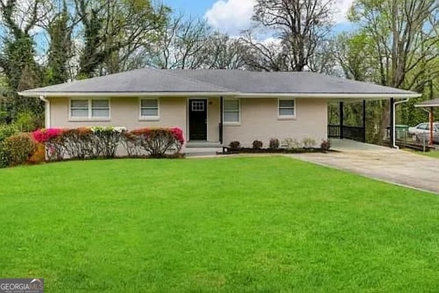 ranch-style house with a front yard and a carport