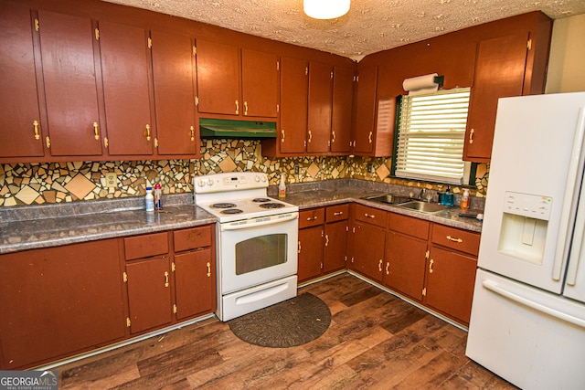 kitchen featuring white appliances, sink, dark hardwood / wood-style floors, a textured ceiling, and tasteful backsplash