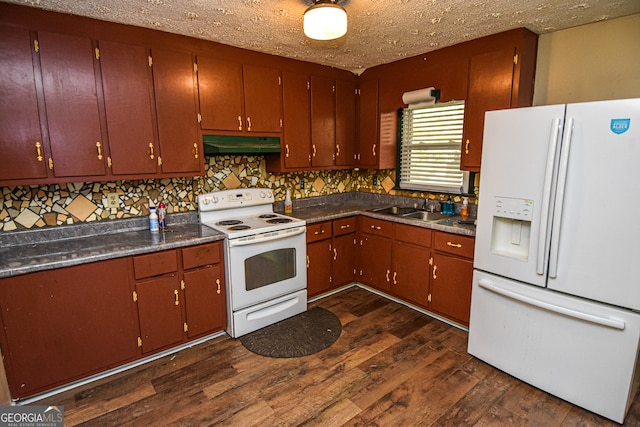 kitchen featuring a textured ceiling, white appliances, dark wood-type flooring, and sink