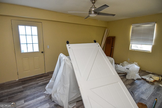 bedroom with hardwood / wood-style flooring and ceiling fan