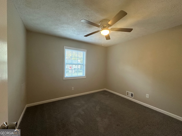 carpeted empty room featuring a textured ceiling and ceiling fan