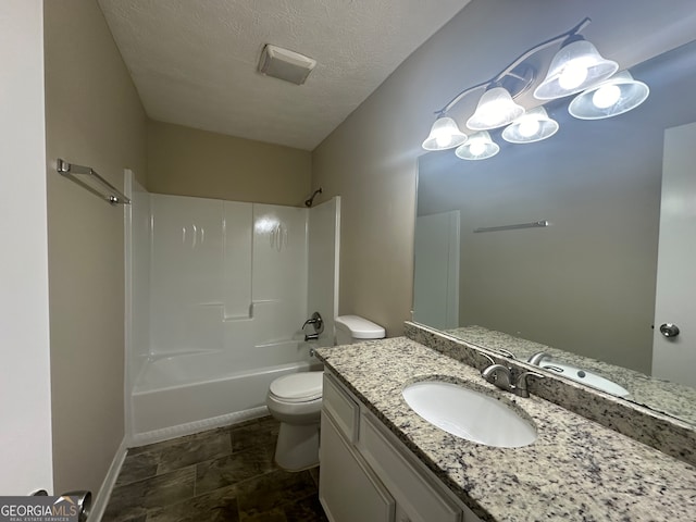 full bathroom with vanity, a textured ceiling, bathing tub / shower combination, and toilet