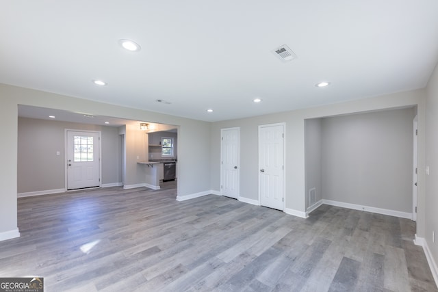 unfurnished living room featuring light hardwood / wood-style flooring