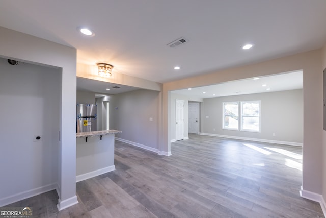 unfurnished living room featuring wood-type flooring