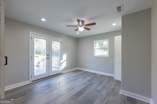 interior space with french doors, ceiling fan, and dark wood-type flooring