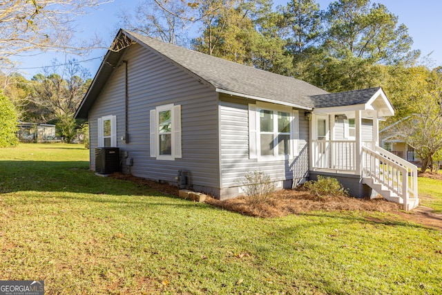 view of property exterior featuring a lawn and central air condition unit