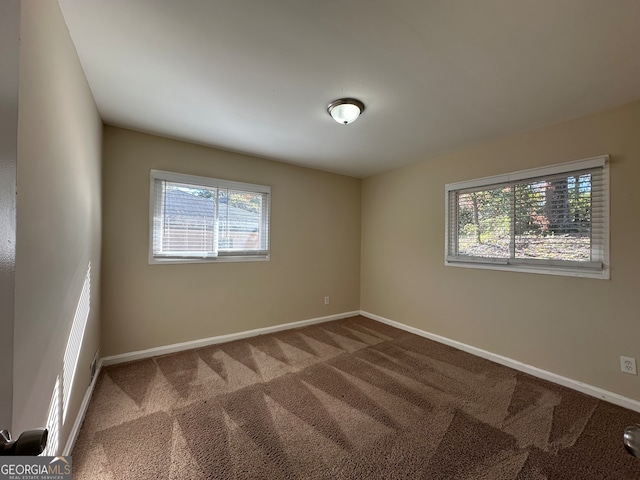 view of carpeted spare room