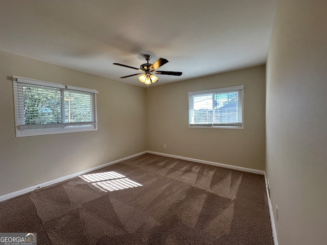 carpeted empty room with ceiling fan