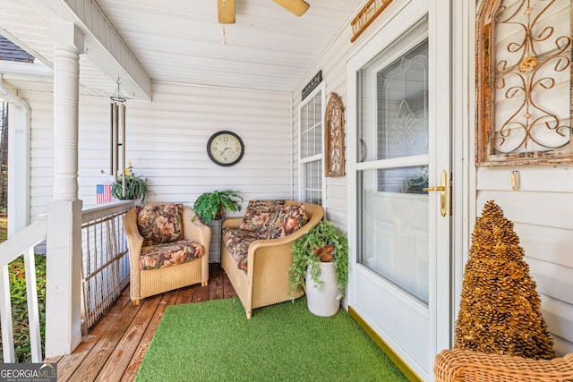 sunroom featuring ceiling fan