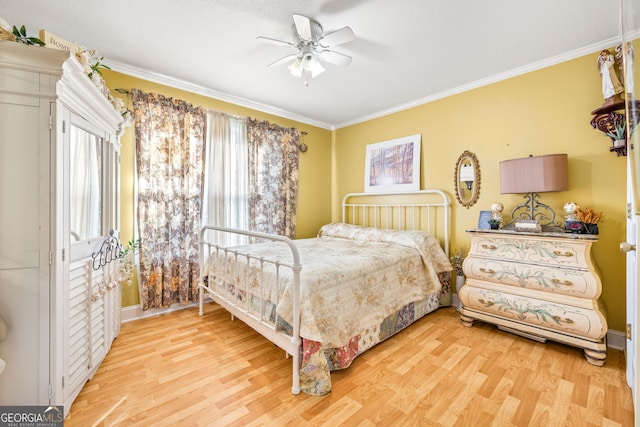 bedroom with wood finished floors, a ceiling fan, and ornamental molding