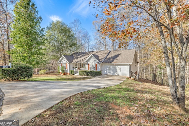 single story home with a garage and a front lawn