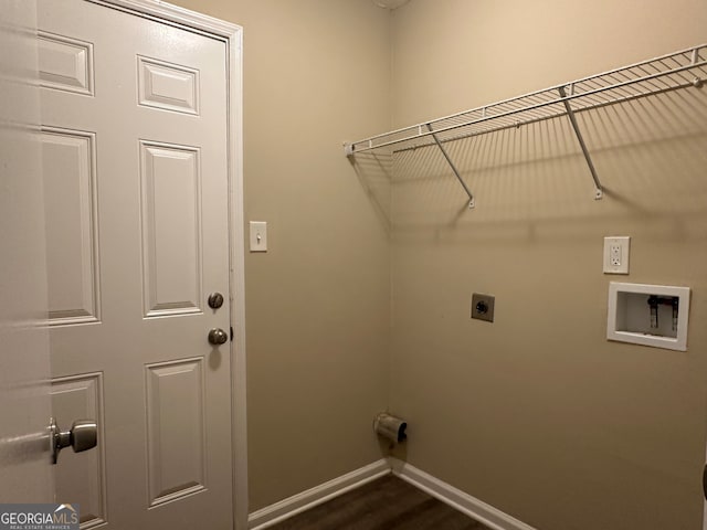 washroom with hookup for a washing machine, dark hardwood / wood-style flooring, and electric dryer hookup