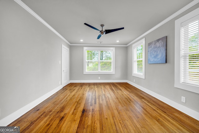 unfurnished room with ceiling fan, crown molding, and light wood-type flooring