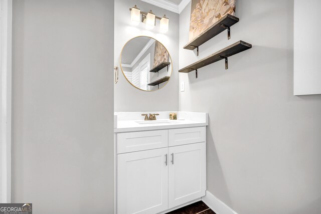 bathroom with tile patterned flooring, vanity, and ornamental molding