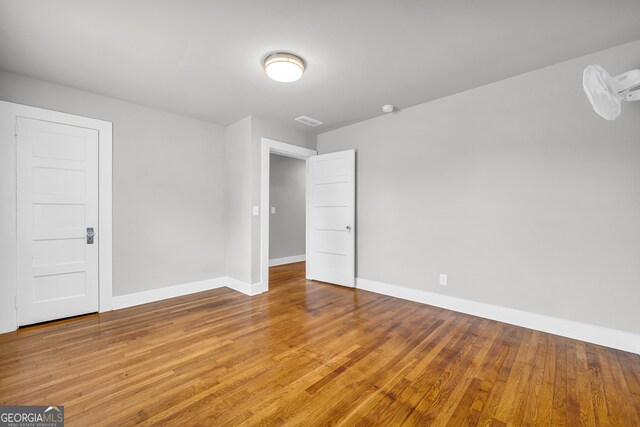 empty room featuring hardwood / wood-style flooring