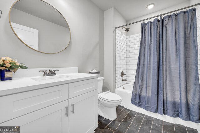 full bathroom featuring shower / bath combo, toilet, and vanity