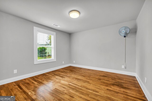 spare room featuring hardwood / wood-style floors