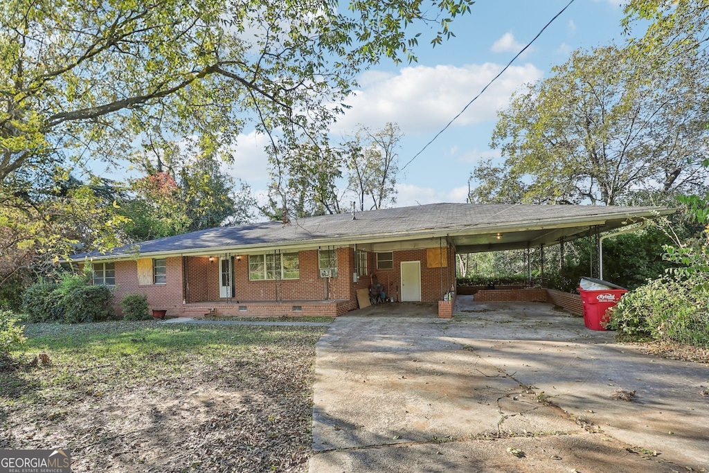 view of front of property with a carport