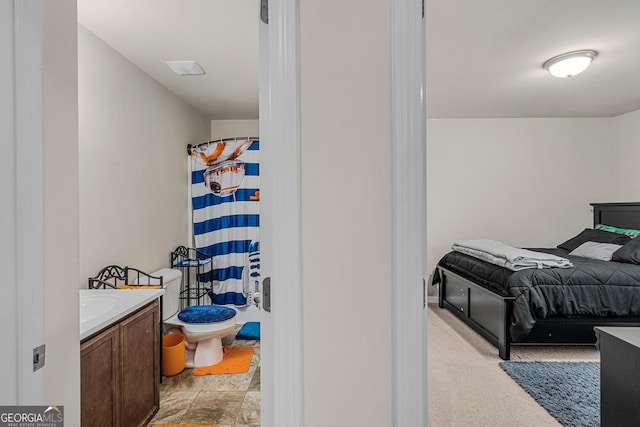 interior space featuring vanity and toilet