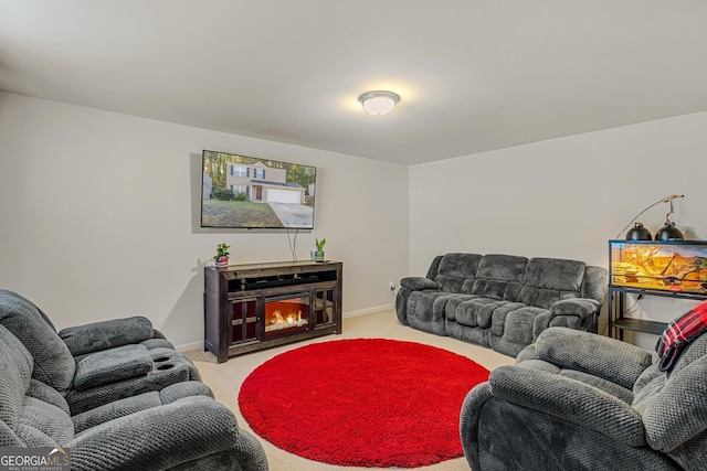 living room featuring light colored carpet and a fireplace