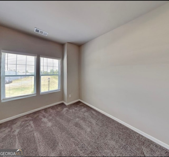 view of carpeted spare room