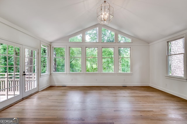 unfurnished sunroom featuring a notable chandelier and a healthy amount of sunlight