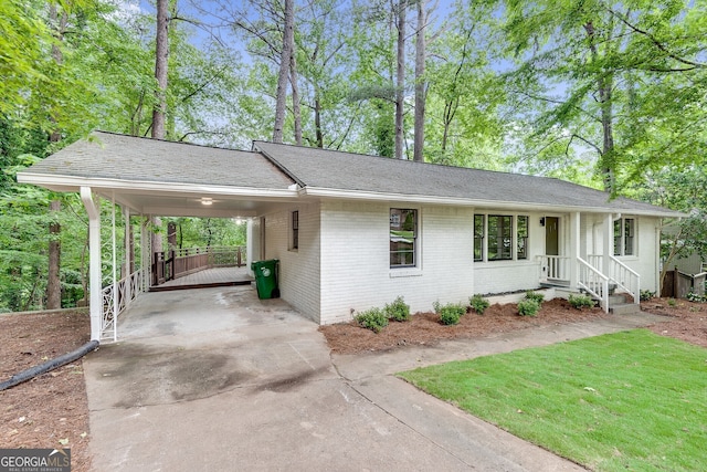 single story home featuring a carport