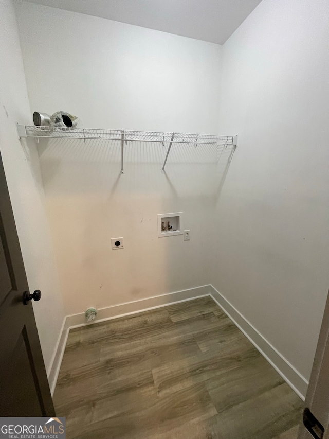 washroom with washer hookup, dark hardwood / wood-style flooring, and electric dryer hookup